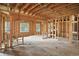 Spacious unfinished living room featuring rough framing and large windows for light at 7843 E Triple Crown Ln, Camby, IN 46113