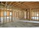 Spacious unfinished living room featuring rough framing and a potential open layout at 7843 E Triple Crown Ln, Camby, IN 46113