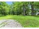 View of sprawling grounds with mature trees providing ample shade and privacy at 7843 E Triple Crown Ln, Camby, IN 46113