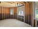 Unfinished space with exposed wooden framework, showcasing window views ready for design touches at 7843 E Triple Crown Ln, Camby, IN 46113