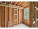 Framed interior showcasing window placement and the start of electrical and plumbing at 7843 E Triple Crown Ln, Camby, IN 46113