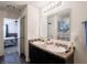 Bathroom featuring double sinks, modern fixtures, and an adjacent bedroom offering comfort and convenience at 8125 Whistlewood Dr, Indianapolis, IN 46239