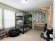 Fun bedroom featuring a triple bunk bed, climbing structure, and playful decor, perfect for  at 8125 Whistlewood Dr, Indianapolis, IN 46239