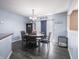 Elegant dining room featuring a stylish chandelier, a round table with seating for six, and modern decor at 8125 Whistlewood Dr, Indianapolis, IN 46239