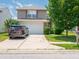 Charming two-story home featuring a two-car garage, well-manicured lawn, and a private driveway at 8125 Whistlewood Dr, Indianapolis, IN 46239