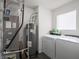 Utility room featuring a washer, dryer, hot water tank, and Bryant HVAC system at 8125 Whistlewood Dr, Indianapolis, IN 46239