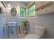 Charming bathroom with a vessel sink, decorative tiling, and natural light from the window at 8167 Center Lake Rd, Nineveh, IN 46164