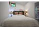 A comfortable bedroom featuring natural light, wood-style headboard and hardwood flooring at 8167 Center Lake Rd, Nineveh, IN 46164