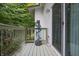 Exterior view of the deck with vibrant green foliage and decor at 8167 Center Lake Rd, Nineveh, IN 46164