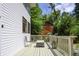 Side deck offers a cozy outdoor seating area with lovely landscaping and access to the front door at 8167 Center Lake Rd, Nineveh, IN 46164