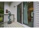Patio with sliding glass doors, decorative art, and a glimpse of the interior at 8167 Center Lake Rd, Nineveh, IN 46164