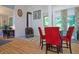 Dining area features wood floors, wood burning stove and vaulted ceiling at 8167 Center Lake Rd, Nineveh, IN 46164