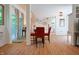 Dining room with wood floors, red chairs, and sliding glass doors at 8167 Center Lake Rd, Nineveh, IN 46164