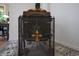 Ornate fireplace screen with decorative details over unique tile flooring at 8167 Center Lake Rd, Nineveh, IN 46164