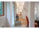 Inviting hallway with a view of dining area and bedroom, decorated with floral curtains and natural light at 8167 Center Lake Rd, Nineveh, IN 46164