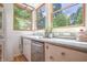 Kitchen area features granite countertops, stainless appliances, wood frame windows and lots of natural light at 8167 Center Lake Rd, Nineveh, IN 46164