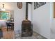 Living area features decor tile accents, a wood burning stove and natural light at 8167 Center Lake Rd, Nineveh, IN 46164
