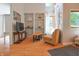 Bright living room features hardwood floors, vaulted ceilings, and decorative shelving for showcasing personal items at 8167 Center Lake Rd, Nineveh, IN 46164