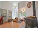 Open living room with fireplace, high ceilings, and bright natural light at 8167 Center Lake Rd, Nineveh, IN 46164