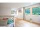 Spacious living room with wood floors, large windows, and a cozy seating area at 8167 Center Lake Rd, Nineveh, IN 46164