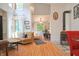 Bright living room with wood floors, neutral furnishings, and fireplace at 8167 Center Lake Rd, Nineveh, IN 46164