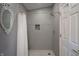 Modern shower featuring decorative tiles, a rainfall shower head, and a built-in niche at 8167 Center Lake Rd, Nineveh, IN 46164