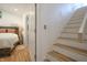 Unique staircase in a home with hardwood steps and a bedroom adjacent at 8167 Center Lake Rd, Nineveh, IN 46164