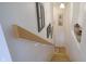 An interior shot of a stairwell with decorative art hanging on the wall at 8167 Center Lake Rd, Nineveh, IN 46164