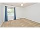 Bright bedroom with soft carpet, large window with curtains and a ceiling fan at 8909 Carnation Dr, Noblesville, IN 46060