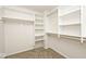 Walk-in closet with shelves, rods, and ample storage at 8909 Carnation Dr, Noblesville, IN 46060