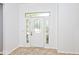 Bright foyer with a decorative door and two sidelights, plus neutral tile floor at 8909 Carnation Dr, Noblesville, IN 46060