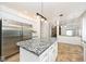 Updated kitchen with granite countertops, stainless steel refrigerator and white cabinets at 8909 Carnation Dr, Noblesville, IN 46060