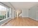 Bright living room with hardwood floors and large window offers a welcoming space at 8909 Carnation Dr, Noblesville, IN 46060