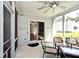 Inviting screened porch features a ceiling fan, string lights, and seating at 8909 Carnation Dr, Noblesville, IN 46060