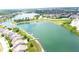 Expansive lake view surrounded by lush greenery and upscale homes, offering luxury living at 9404 Crystal River Dr, Indianapolis, IN 46240