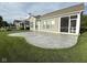 Large stamped concrete patio offering scenic views of the backyard and access to the screened porch at 9404 Crystal River Dr, Indianapolis, IN 46240