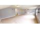 Large bonus room featuring neutral carpet, gray walls, and natural light at 9404 Crystal River Dr, Indianapolis, IN 46240