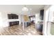 This spacious kitchen features an island, modern cabinets, and stainless steel appliances with wood flooring at 9404 Crystal River Dr, Indianapolis, IN 46240