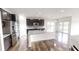 Bright, open kitchen features stainless steel appliances, a large island, and dark wood cabinets at 9404 Crystal River Dr, Indianapolis, IN 46240