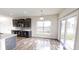 Open concept kitchen with island, dark cabinets, and stainless steel appliances, plus an eat in breakfast nook at 9404 Crystal River Dr, Indianapolis, IN 46240