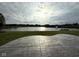 Scenic view of the lake from the stamped concrete patio, ideal for relaxing and entertaining at 9404 Crystal River Dr, Indianapolis, IN 46240