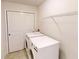 Laundry room featuring white washer and dryer, storage, and a closet at 9404 Crystal River Dr, Indianapolis, IN 46240