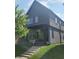 Contemporary two-story home with a well-manicured lawn and concrete steps leading to the covered front porch at 955 Dorman St, Indianapolis, IN 46202