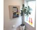 Hallway with decorative art and indoor plants, bringing a touch of nature and color to the space at 955 Dorman St, Indianapolis, IN 46202