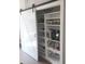 Well-organized pantry with a sliding barn door, ample shelving, and storage space for kitchen essentials at 955 Dorman St, Indianapolis, IN 46202