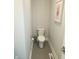 Simple and functional toilet in a small half bathroom at 955 Dorman St, Indianapolis, IN 46202