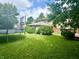 Well-maintained backyard with green lawn and a trampoline at 9621 Gemini Dr, Indianapolis, IN 46229