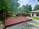 View of wooden backyard deck and grassy yard at 9621 Gemini Dr, Indianapolis, IN 46229