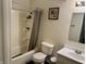 A standard bathroom featuring a shower-tub combo, toilet, and sink at 9621 Gemini Dr, Indianapolis, IN 46229