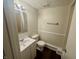 A cozy bathroom featuring a shower-tub combo, toilet, and sink at 9621 Gemini Dr, Indianapolis, IN 46229